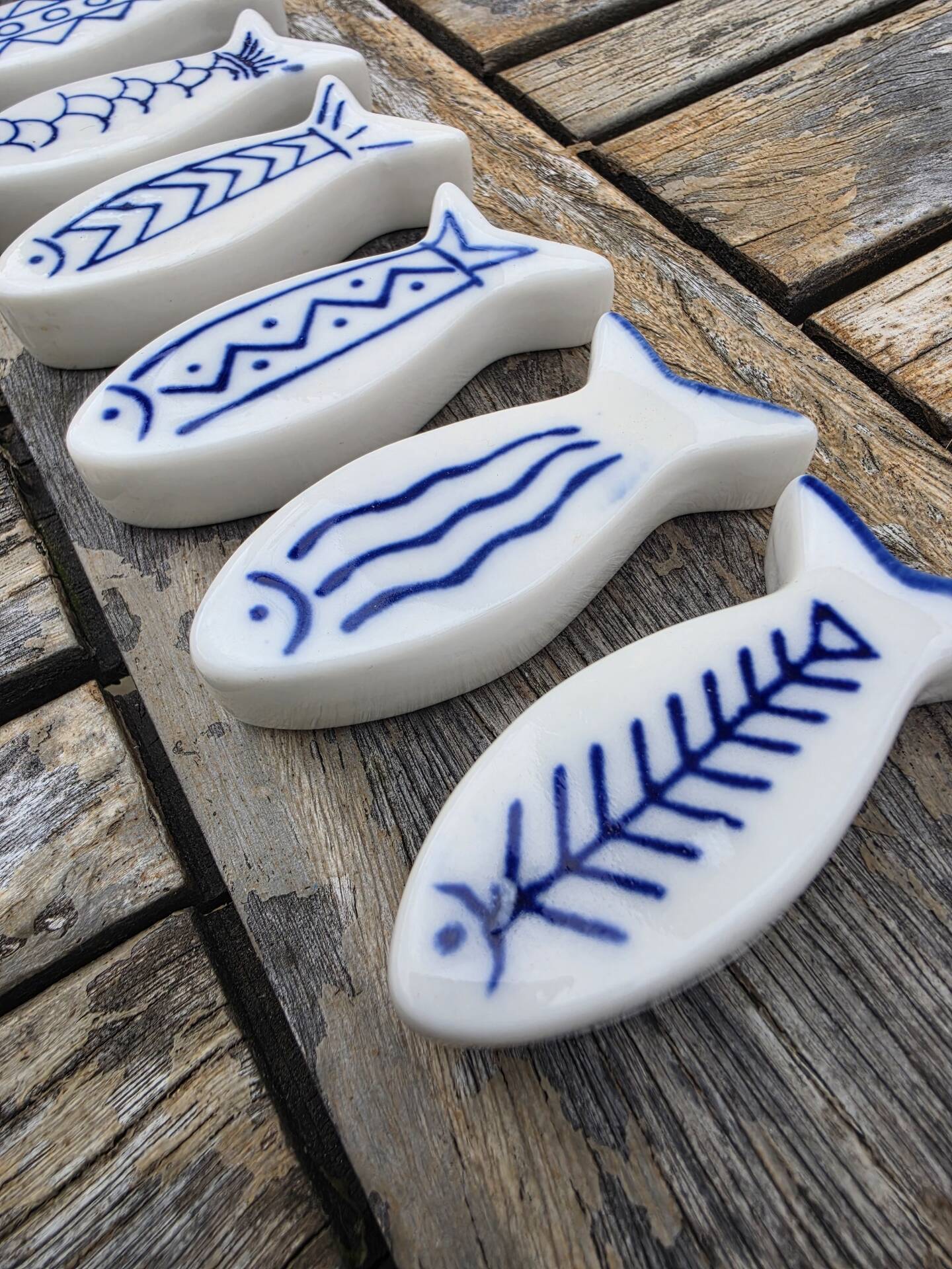 Set of 6 vintage ceramic painted fish motif spoon rests.