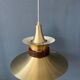 Large UFO flying saucer pendant light with orange light.