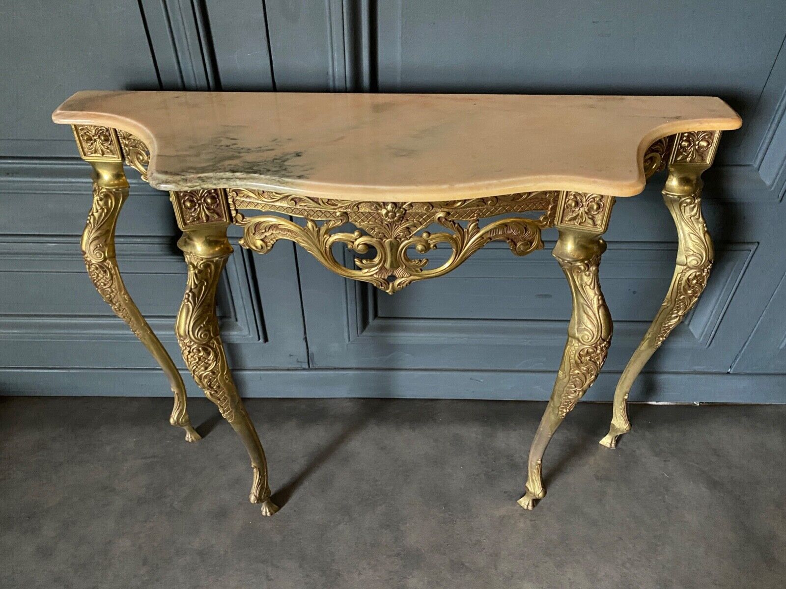 Gilded bronze console Louis XV style and its Mirror Mid-twentieth Marble