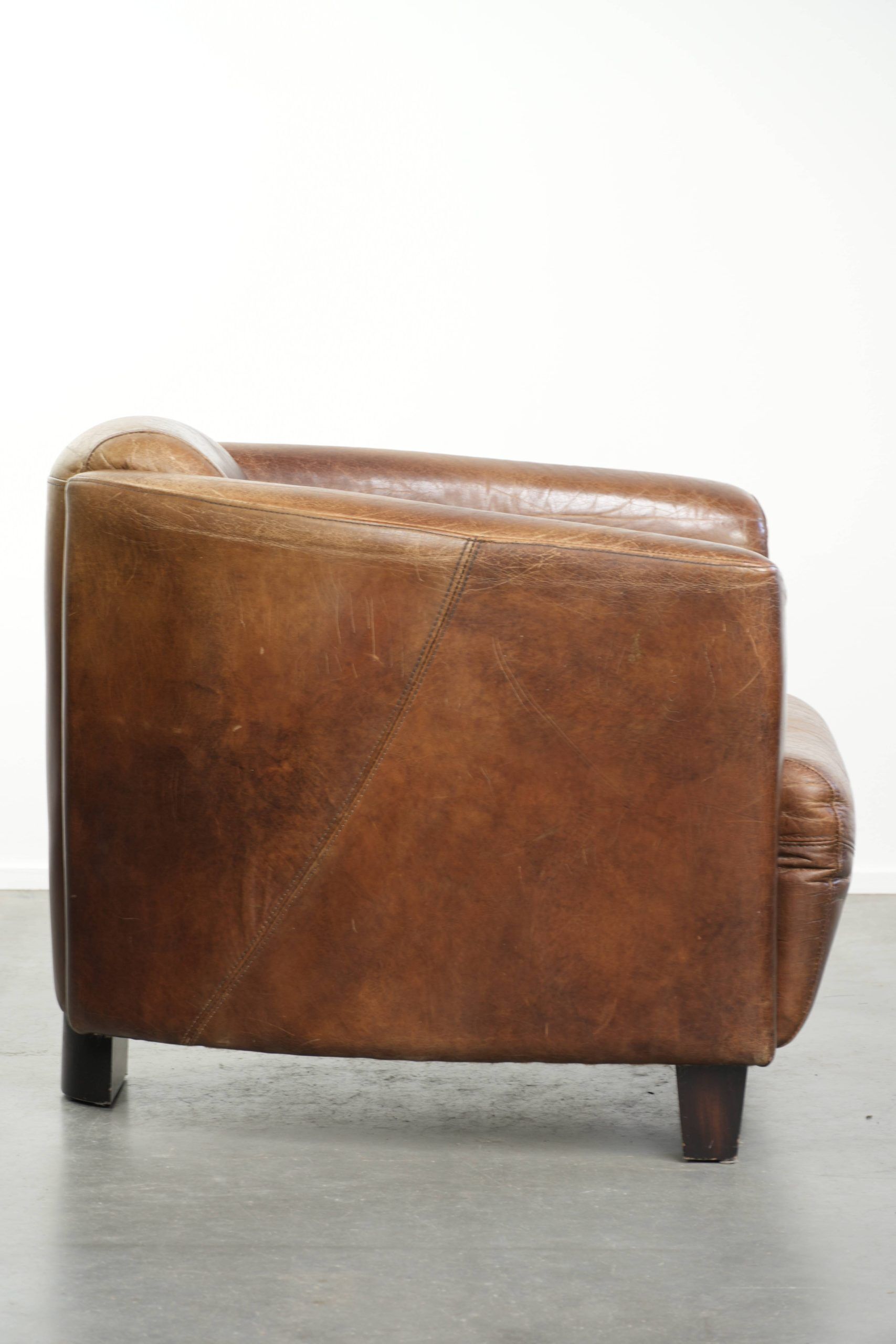 Fauteuil design aviateur en cuir de vache couleur cognac robuste