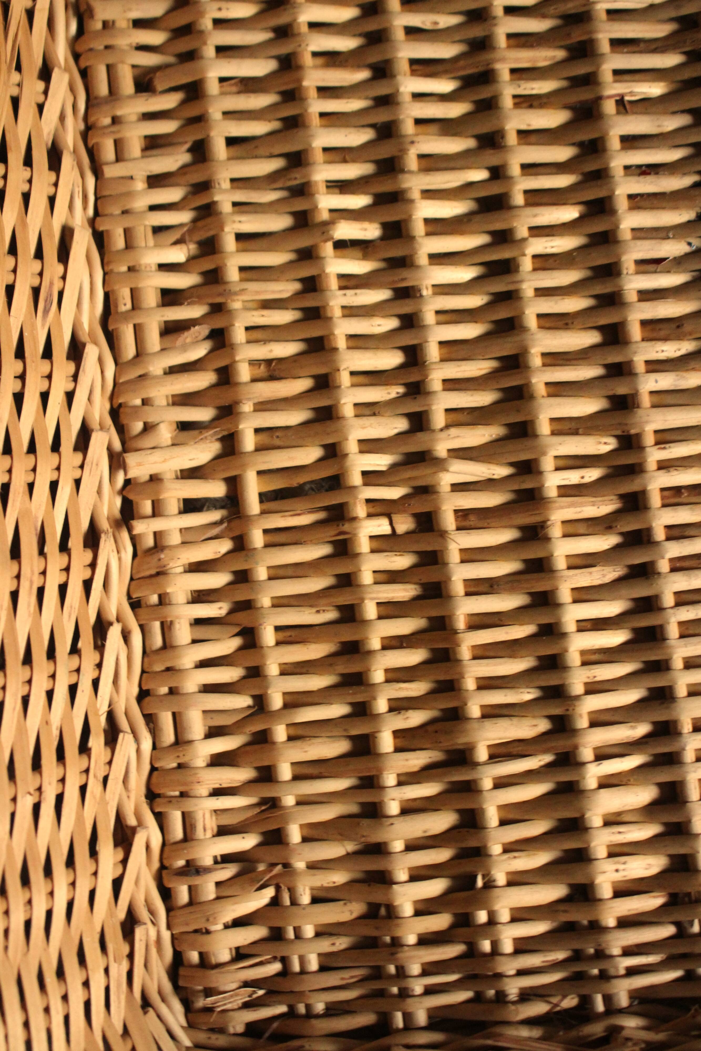 A large vintage rectangular wicker basket