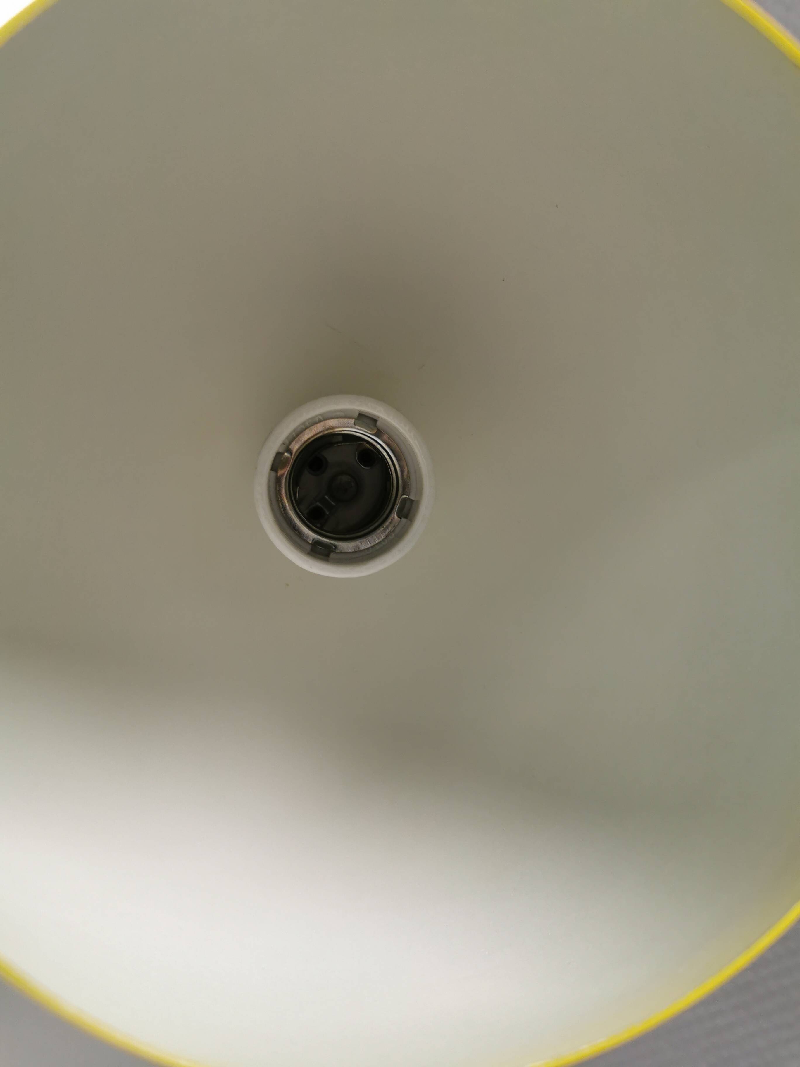 Spherical pendant lamp in sunny yellow.