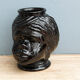 Molded glass vase, nubian's head