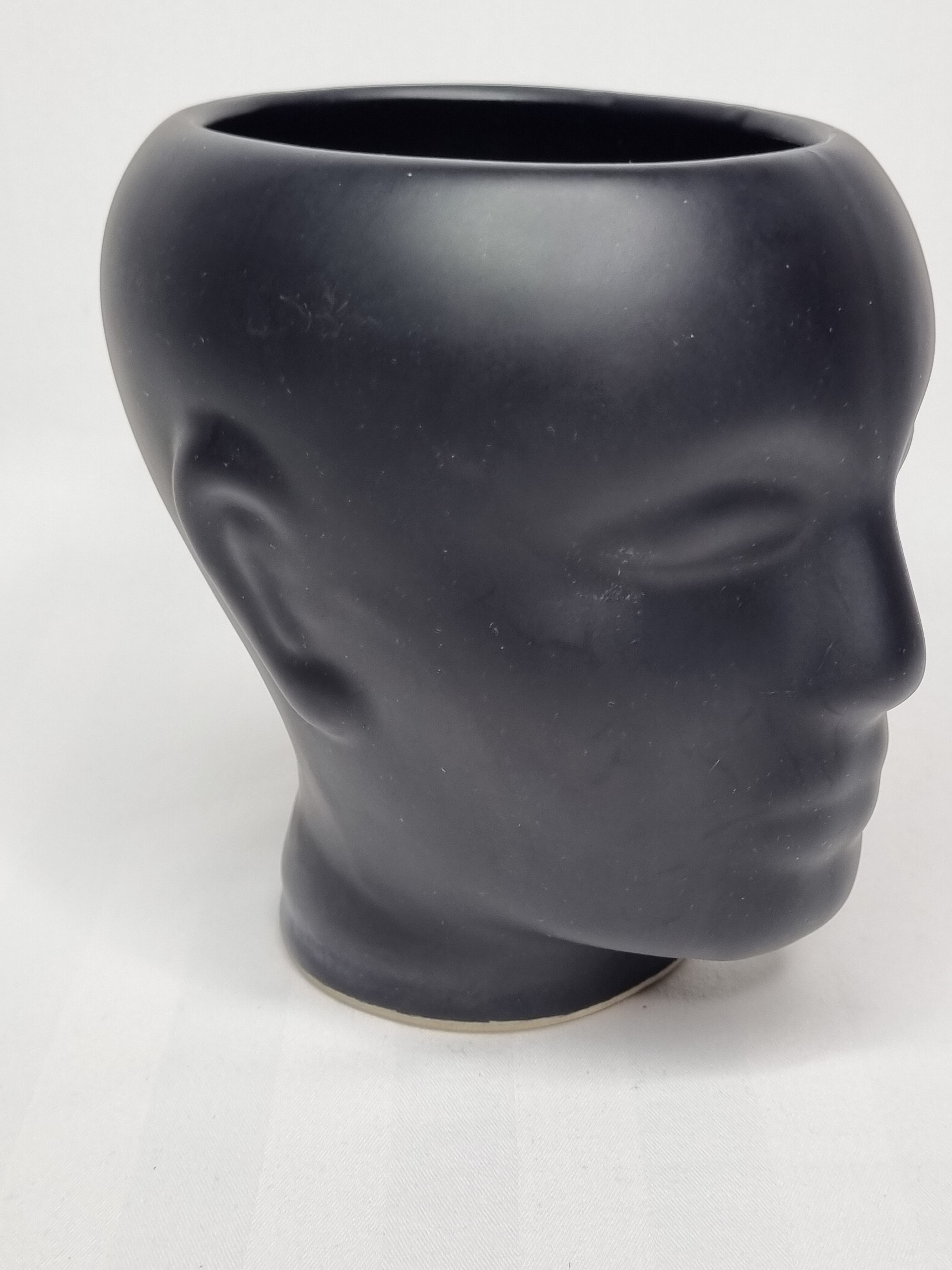 Anthropomorphic pot cover in matt black glazed ceramic, 80s