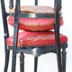 Pair of old black wooden chairs and Red seat.