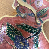 Empty pockets in brass and floral decoration