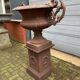 Large cast iron vase with pedestal