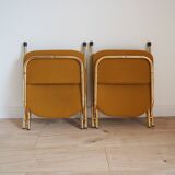 2 Vintage Eyrel folding chairs in mustard yellow and gold – Chic retro design