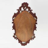 Baroque style oval wall mirror in gilded wood, France