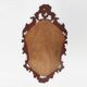 Baroque style oval wall mirror in gilded wood, France