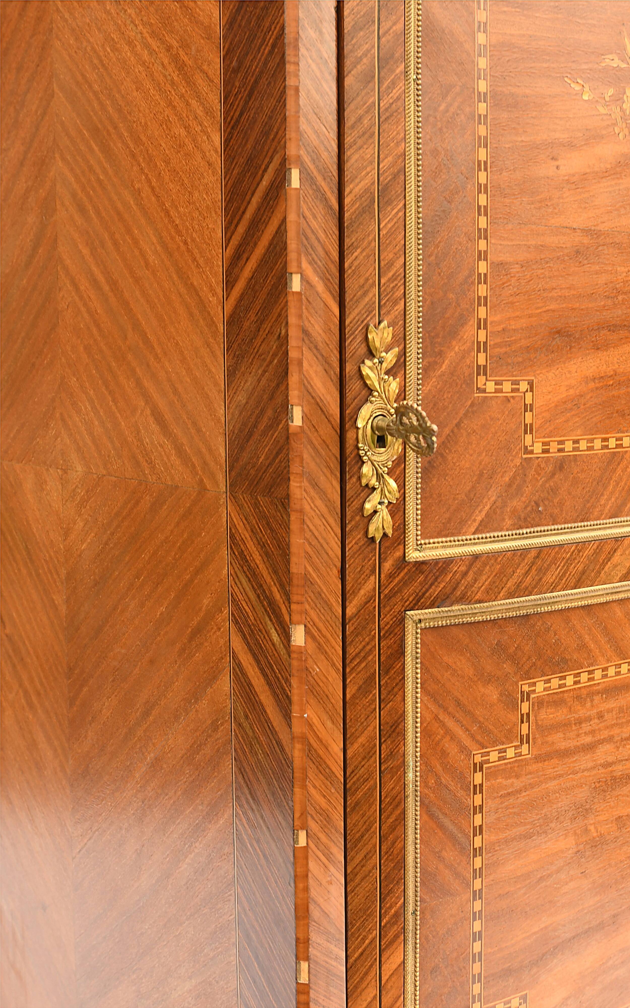 In-between furniture in marquetry decorated with a trophy decoration of musical instruments