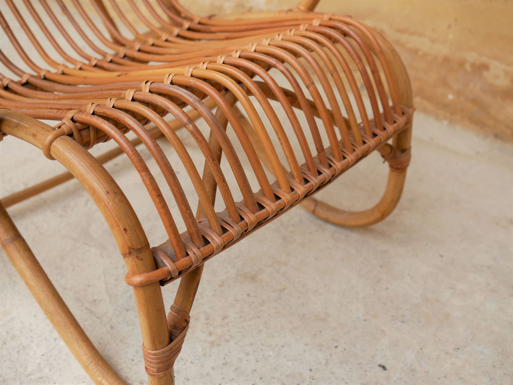 Vintage rattan chair by Louis Sognot