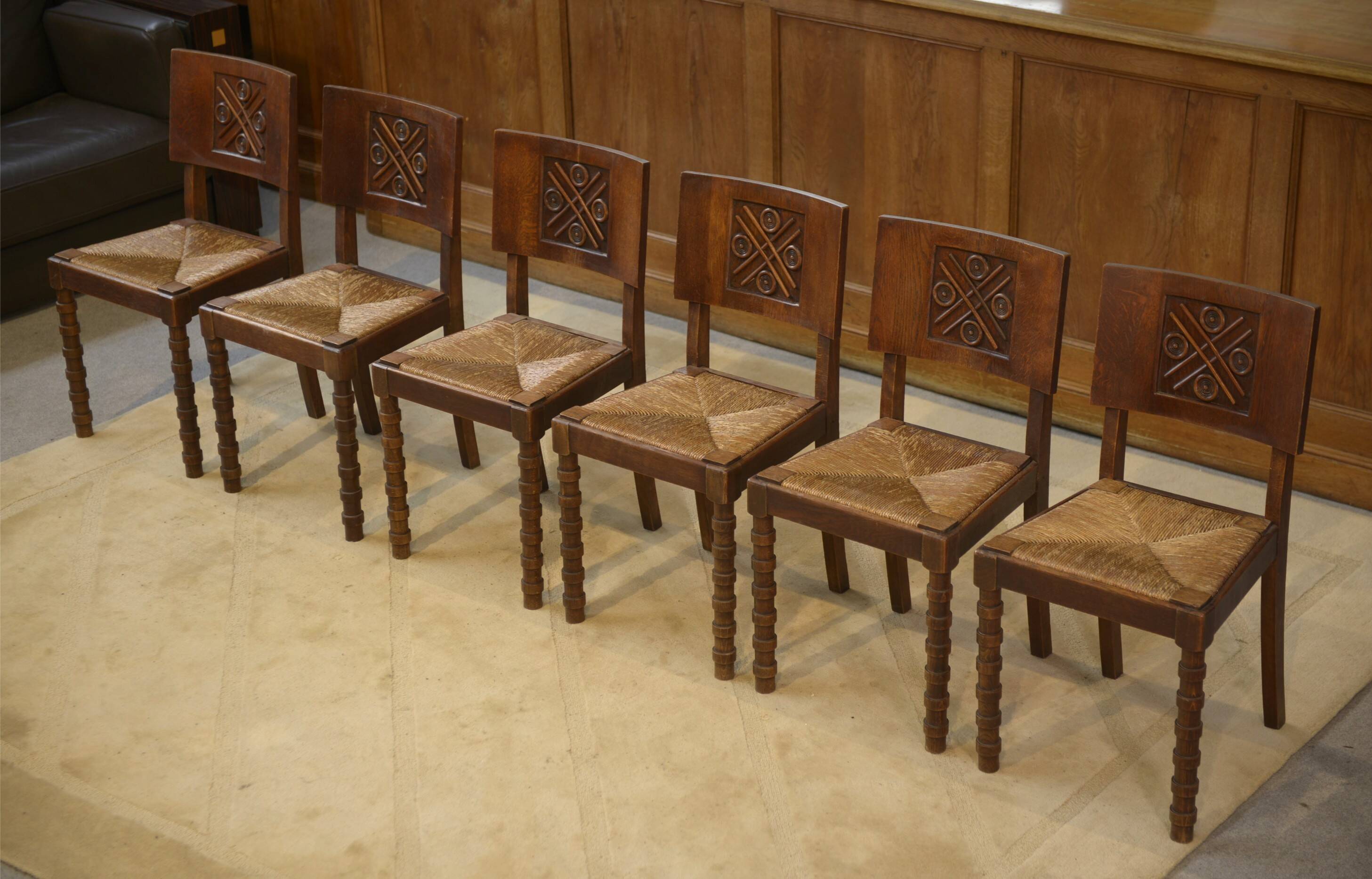 Ensemble de 6 chaises Charles Dudouyt en chêne 1950’s