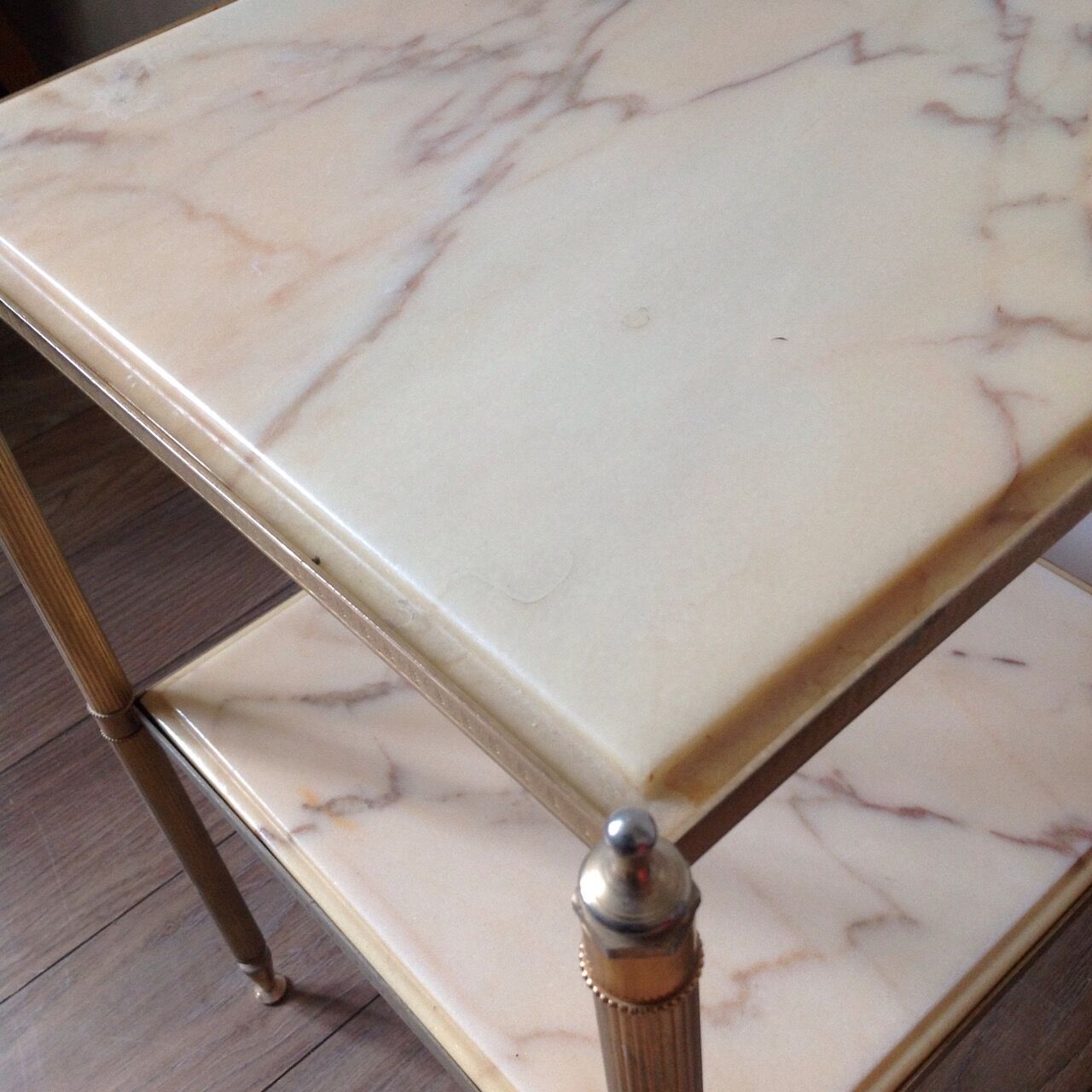 Marble and gilded metal sofa end