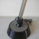 Super Chrome old articulated metal desk lamp on workshop decor base