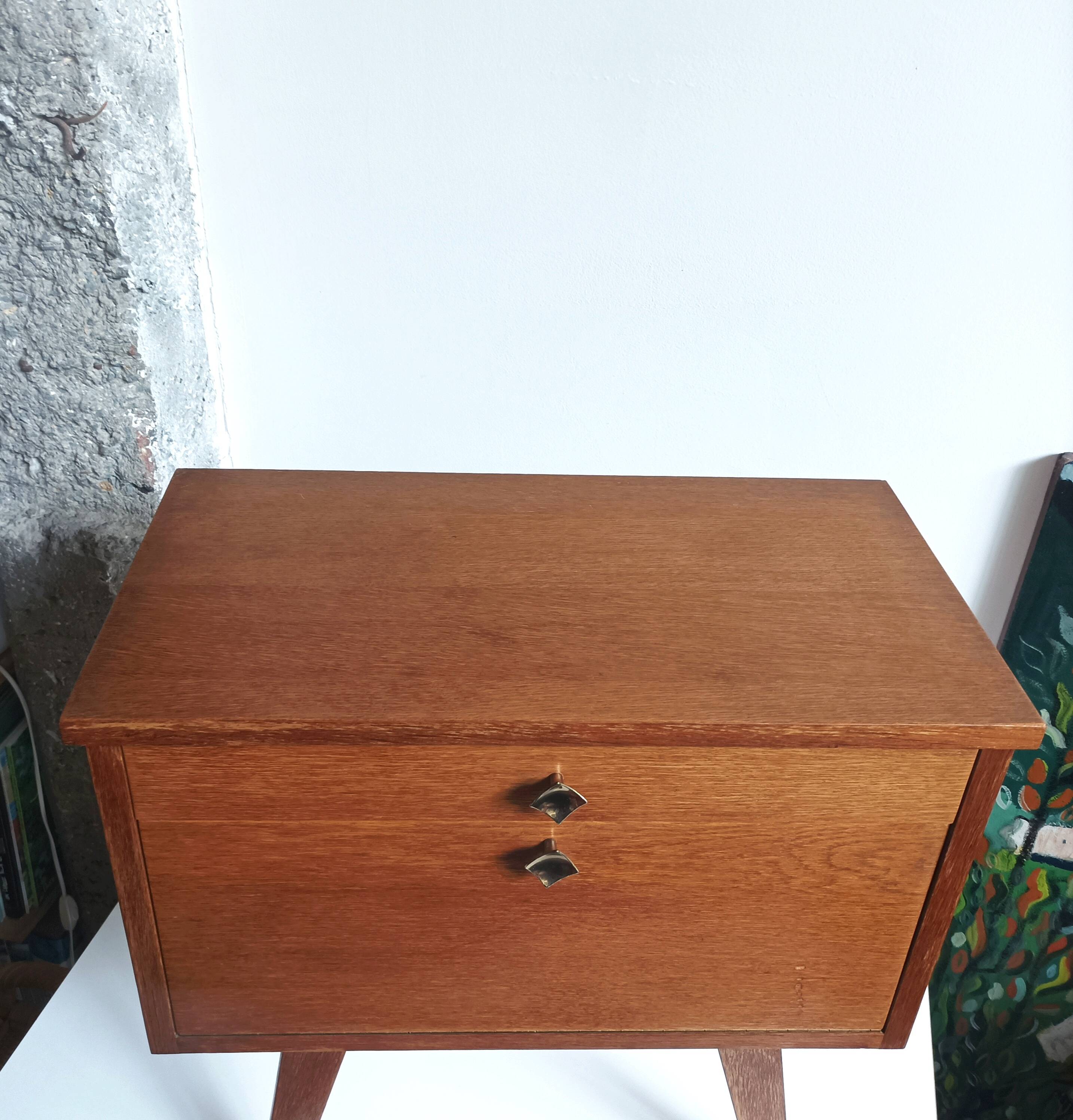 Wooden bedside table with vintage compass legs