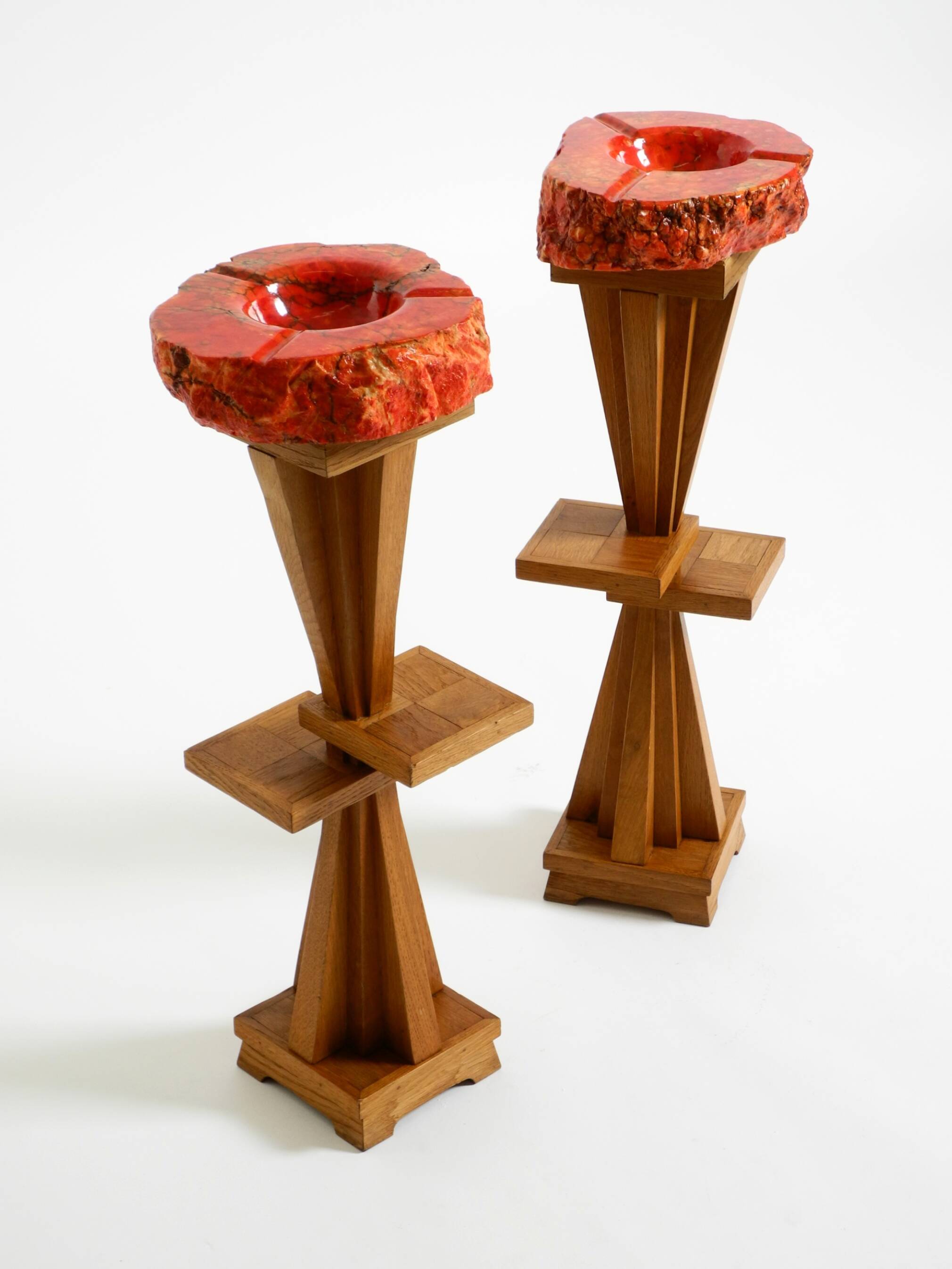 Two mid-century standing ashtrays consisting of red Alabaster cup