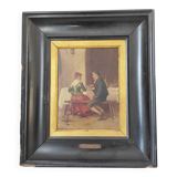 Couple seated at a table in an inn, signed oil on panel, 19th century