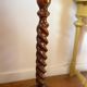 Antique pedestal table with a twisted column.