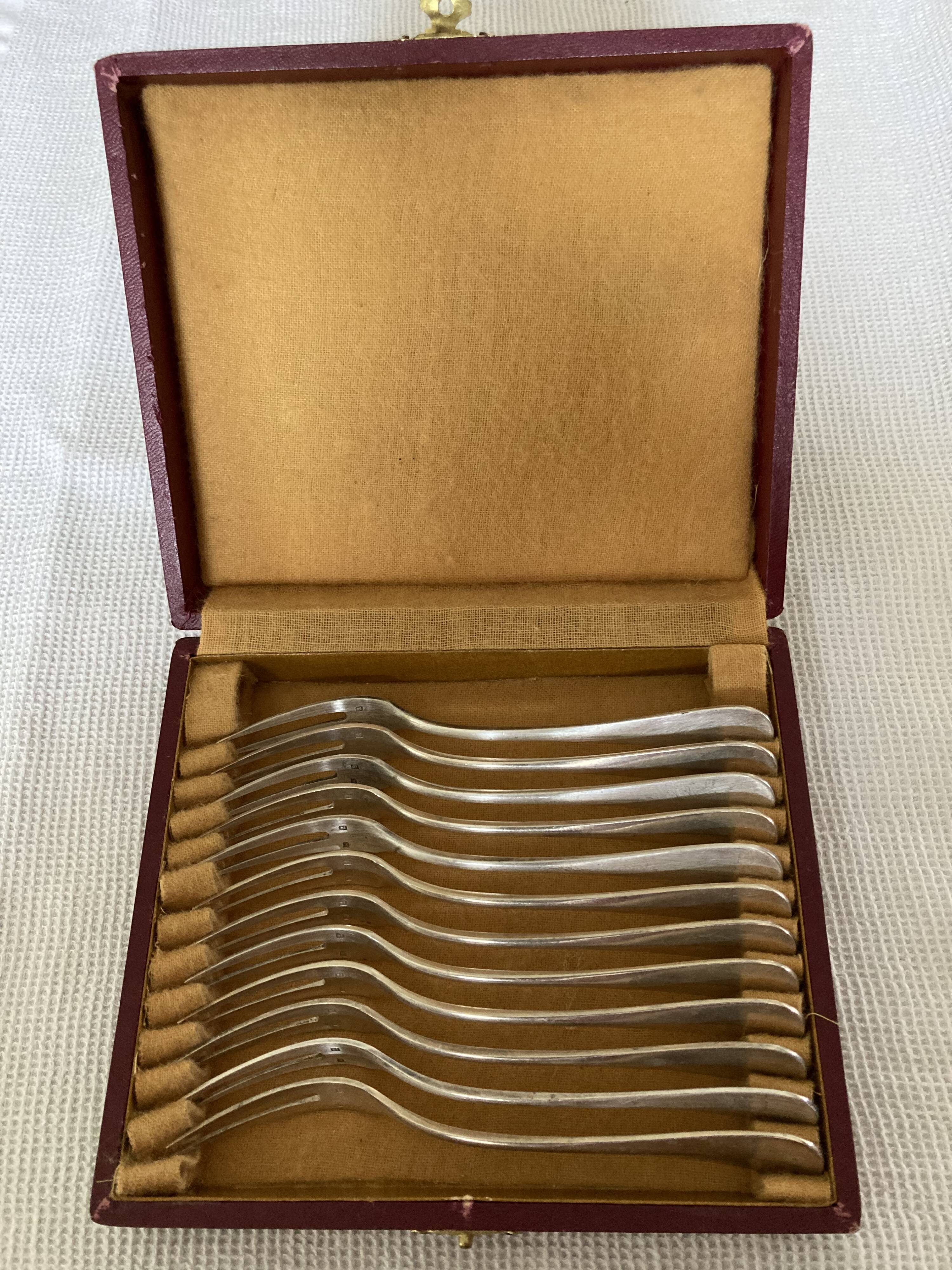 12 fourchettes à escargot en métal argenté