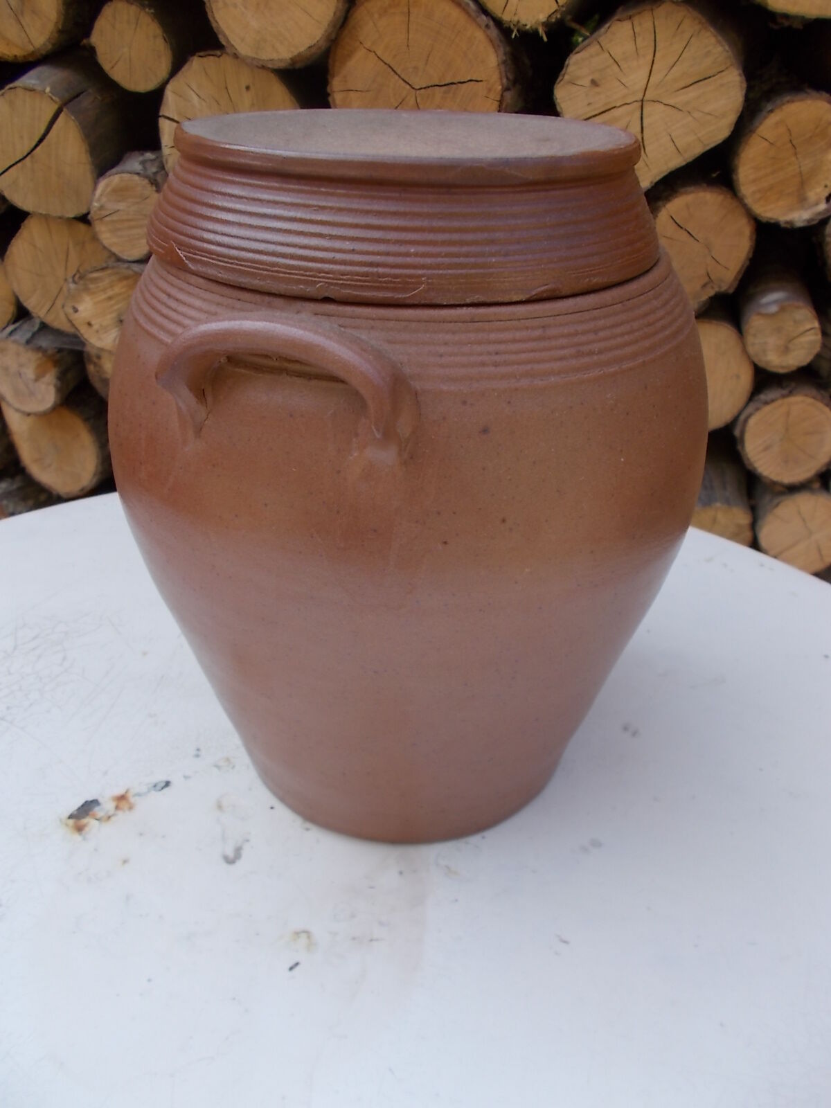 Old sandstone pot and its lid