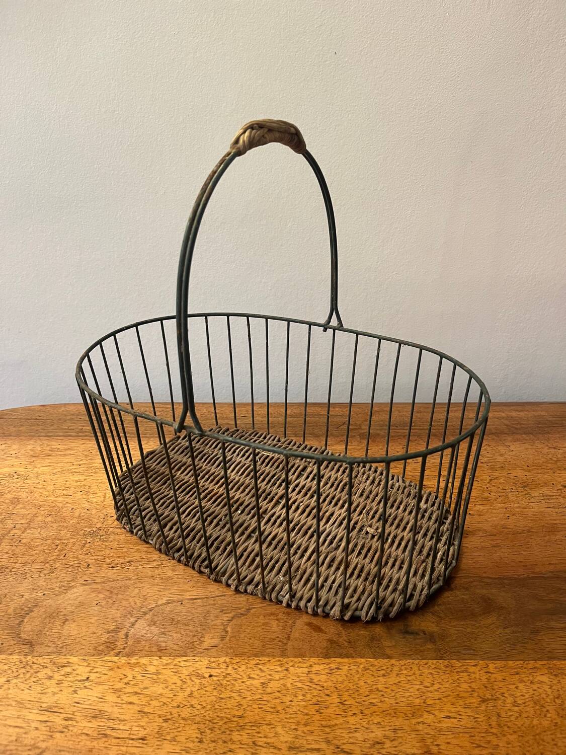 Small wicker and green metal basket