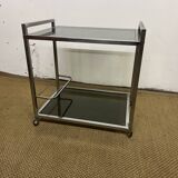 1970s coffee table in brass with a double smoked glass top.