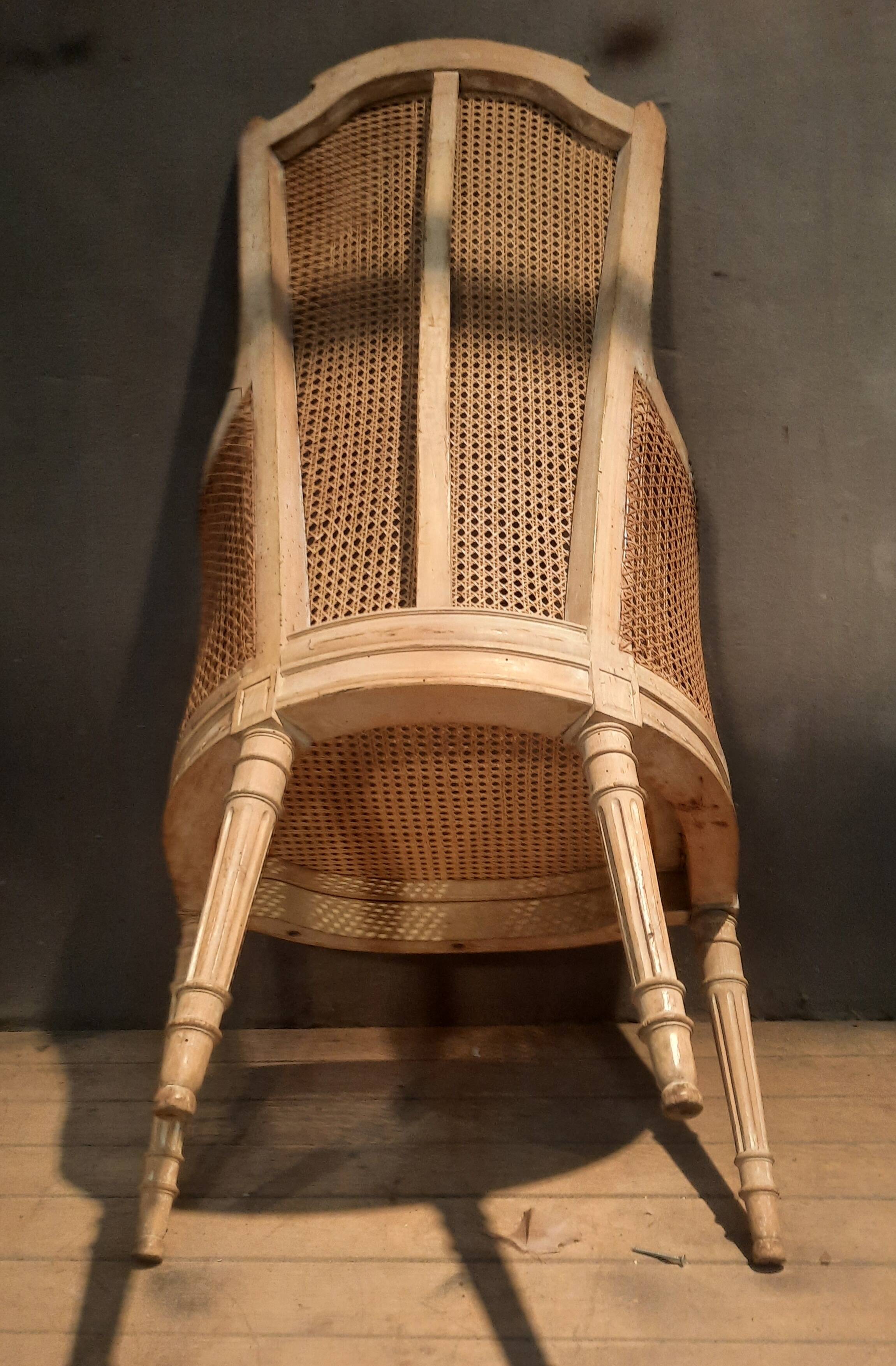 Louis XVI high-backed caned armchair