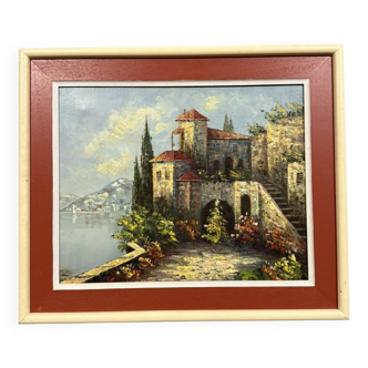 Italian School: painting of a castle on the edge of a lake