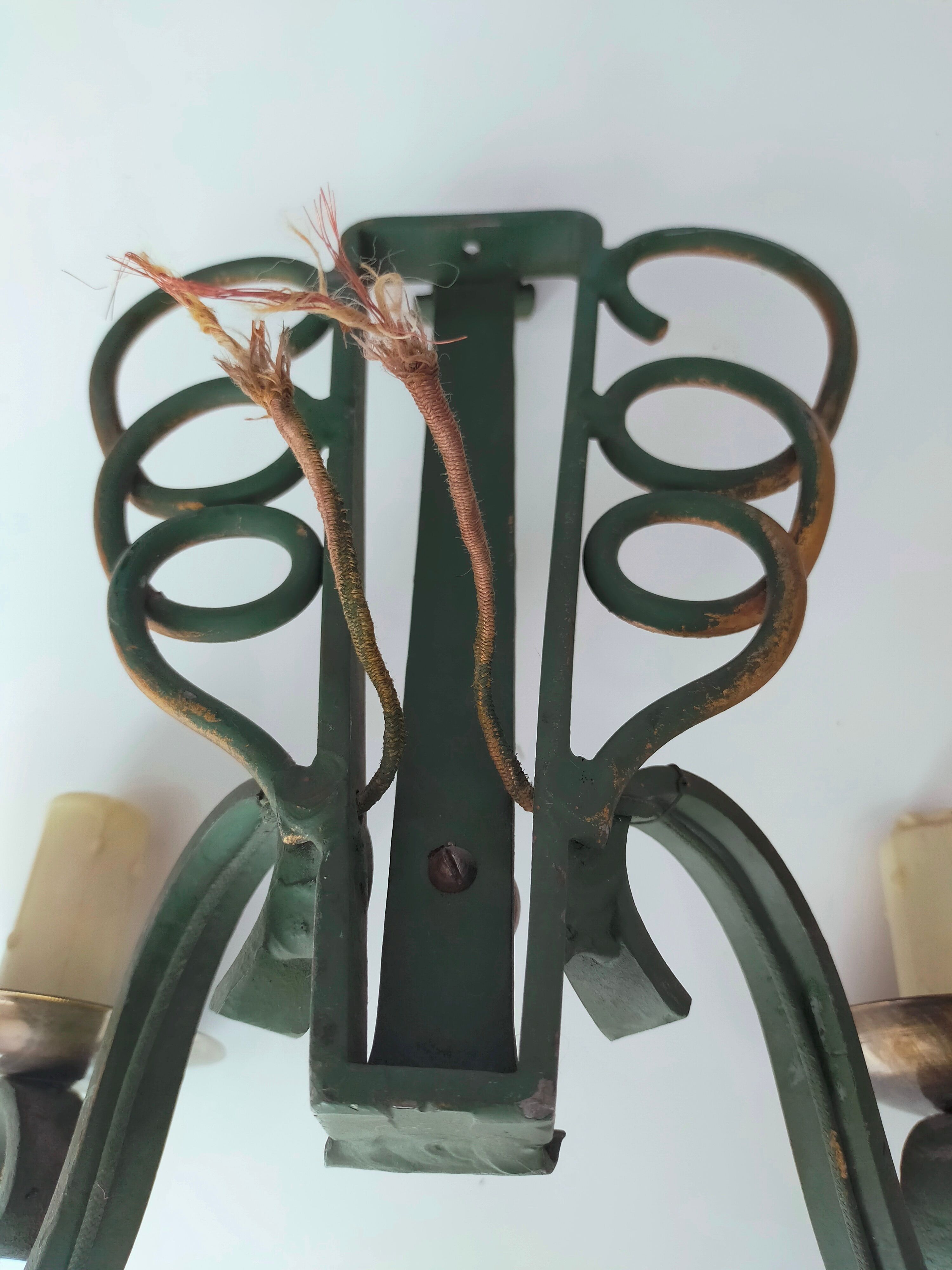 Pairs of vintage wrought iron wall lamps