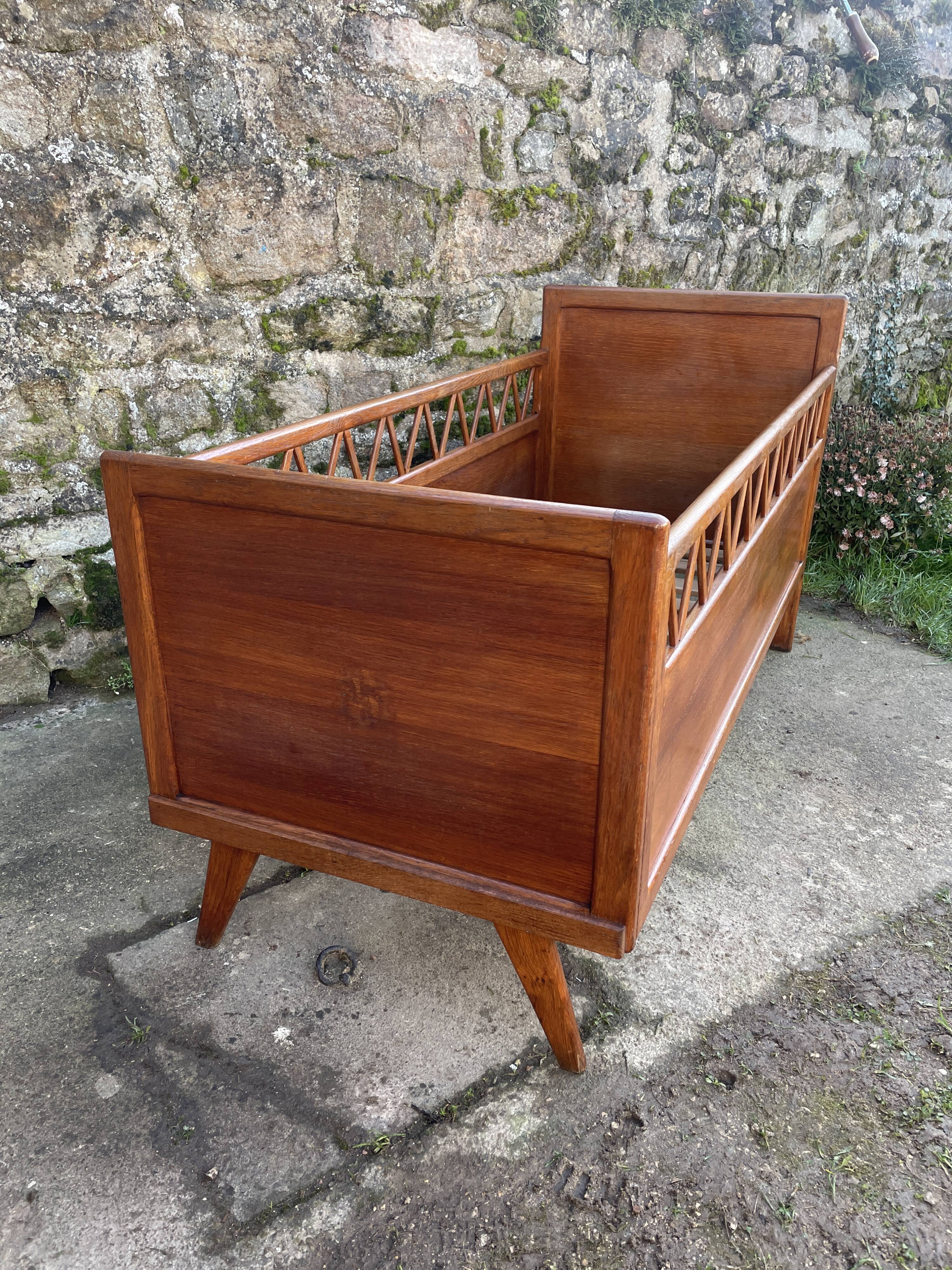 Handmade children's bed with compass feet 1950