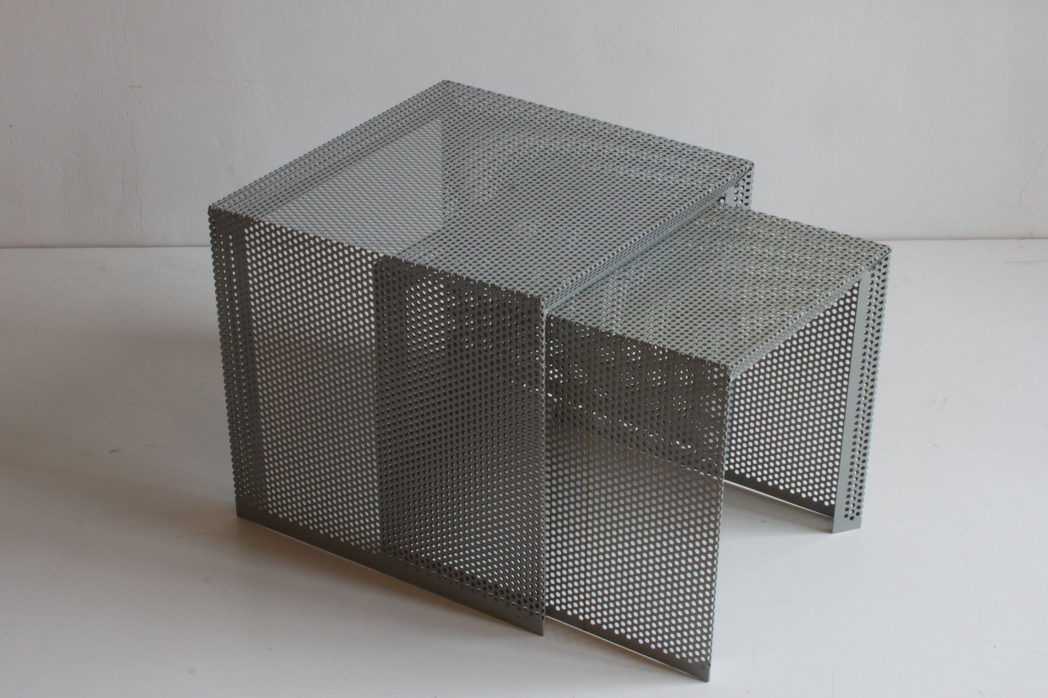 Grey perforated metal nesting side tables, 1990s set of two.