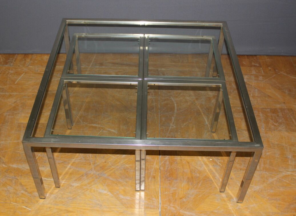 Coffee table and its steel and glass wiggles around 1970