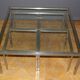 Coffee table and its steel and glass wiggles around 1970