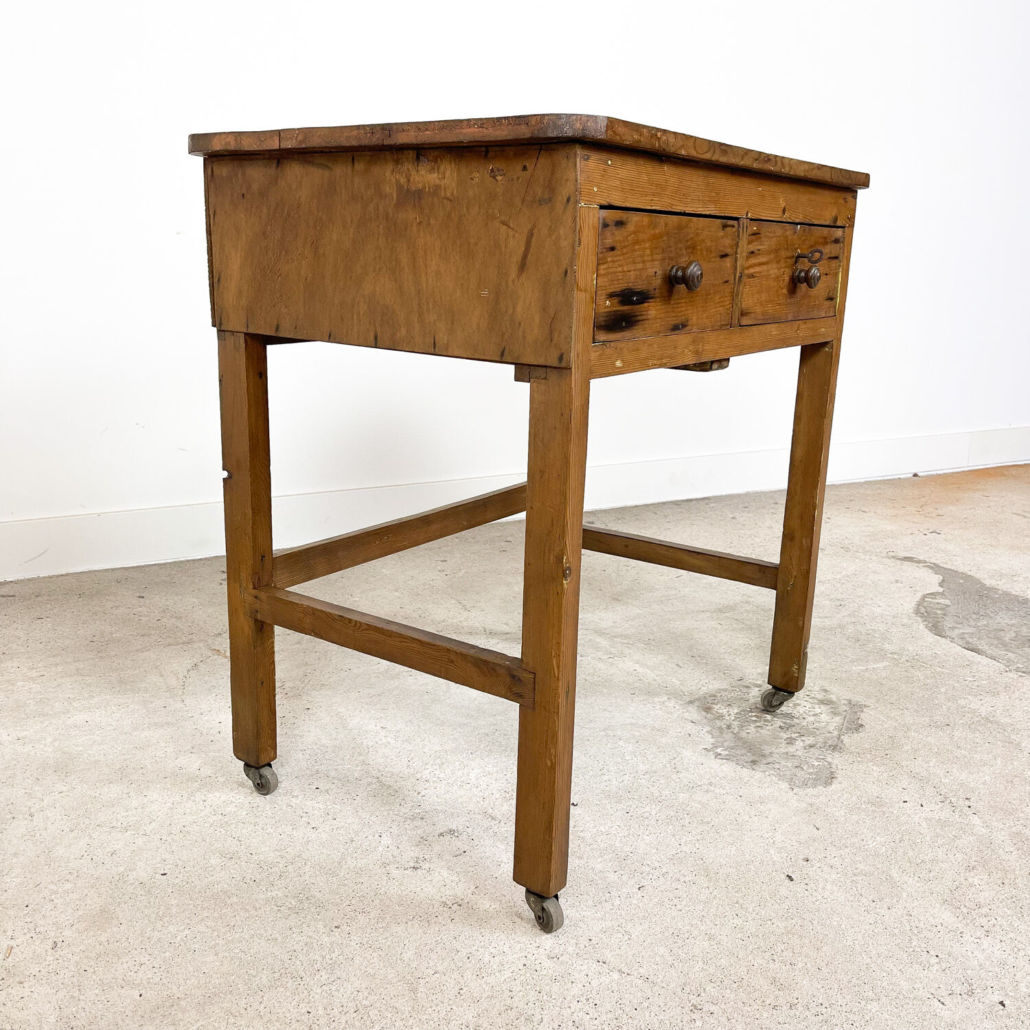 Vintage industrial wooden side table with drawers on casters