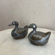 Pair of vintage decorative metal boxes in silver, shaped like ducks.