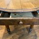 Table with oval shutter in walnut foot turned
