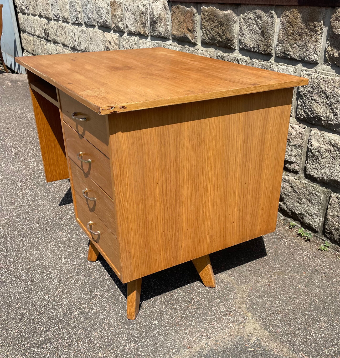 Double-sided desk with compass legs.