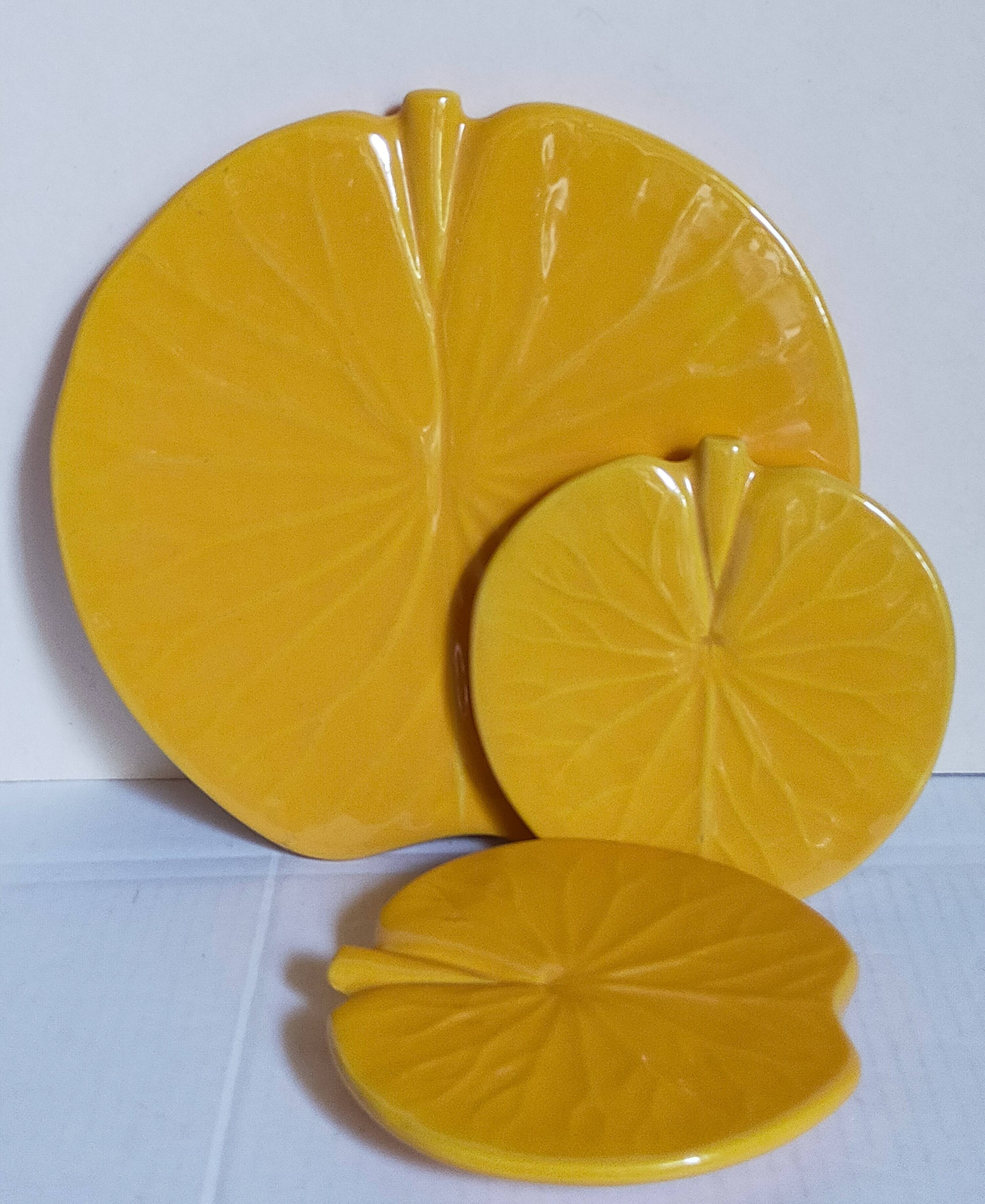 Three vintage water lily presentation dishes in slip