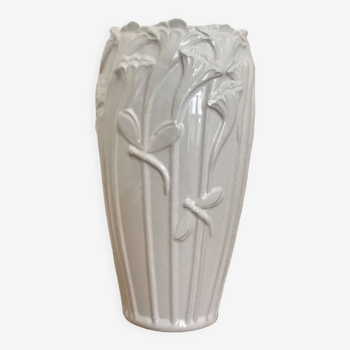 Old white art nouveau vase with flowers and dragonflies