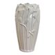 Old white art nouveau vase with flowers and dragonflies
