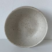 Meeting of three artist's ceramic objects including two pots and a cream covered bowl