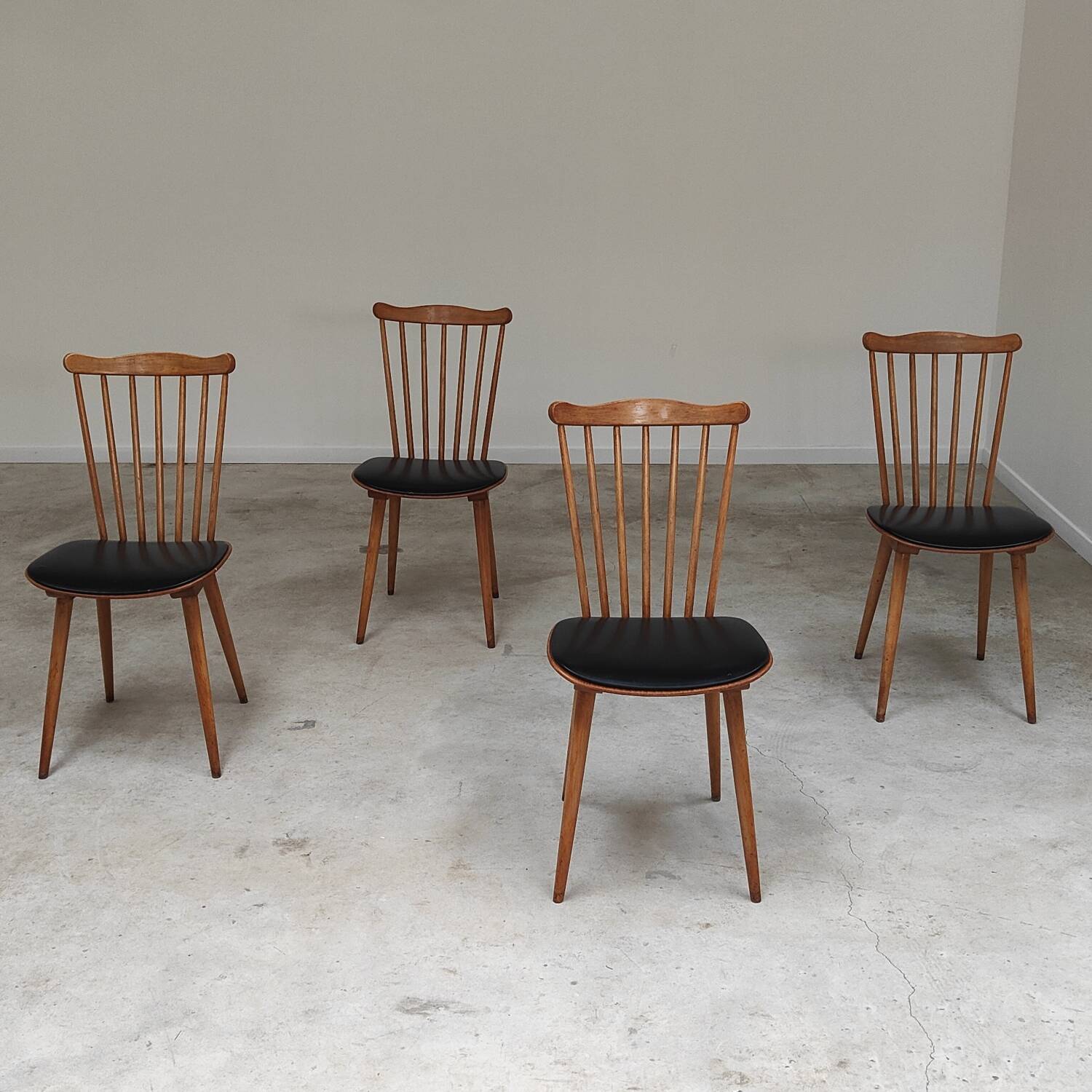 Set of 4 Baumann Menuet chairs black leatherette compass legs