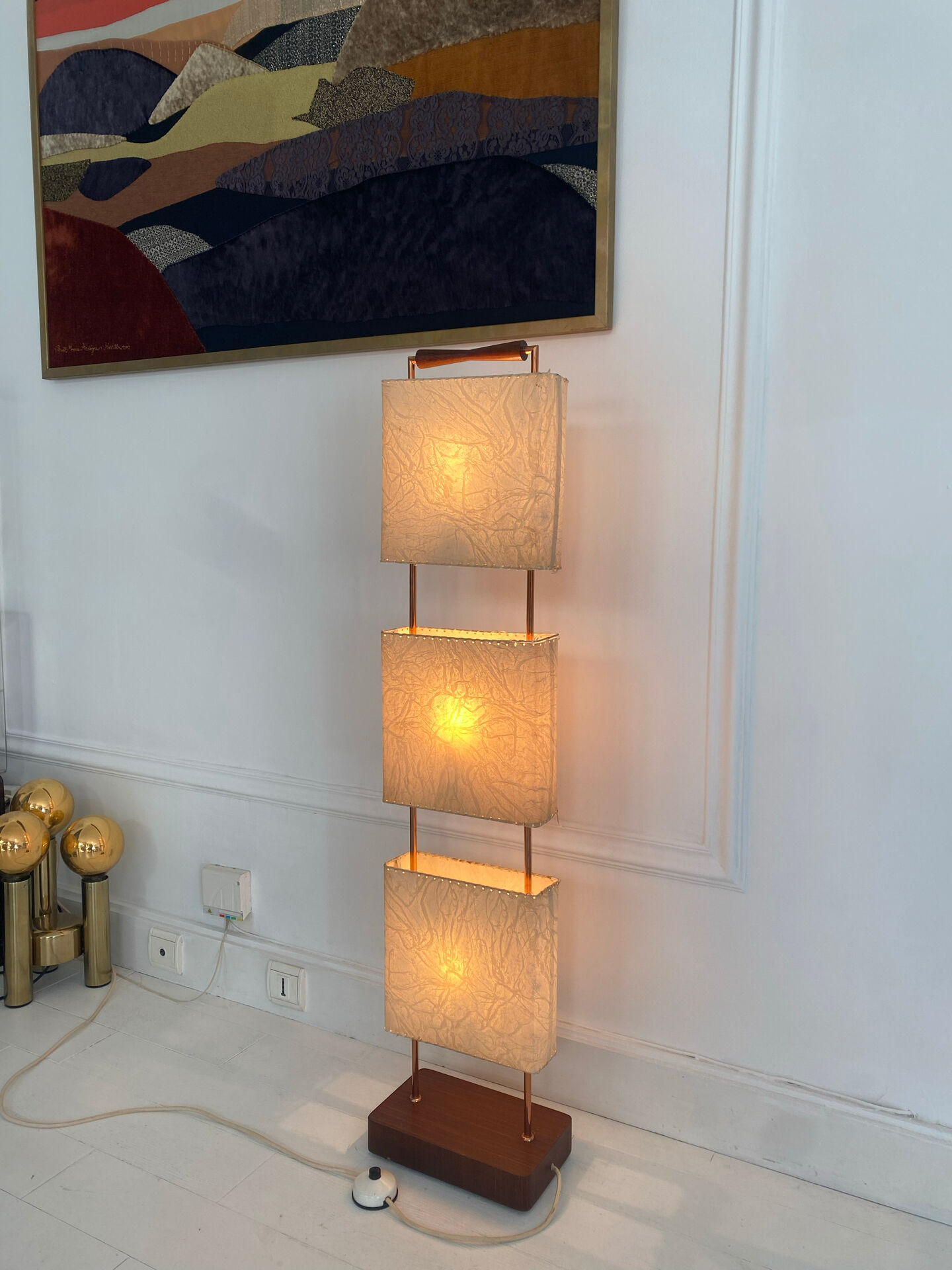 Wood and copper metal floor lamp with parchment.