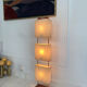 Wood and copper metal floor lamp with parchment.