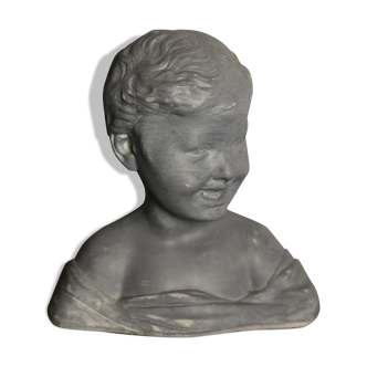 Child bust in grey patinated plaster