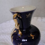 Revol porcelain vase, showcase object, romantic decor, blue background, golden handles
