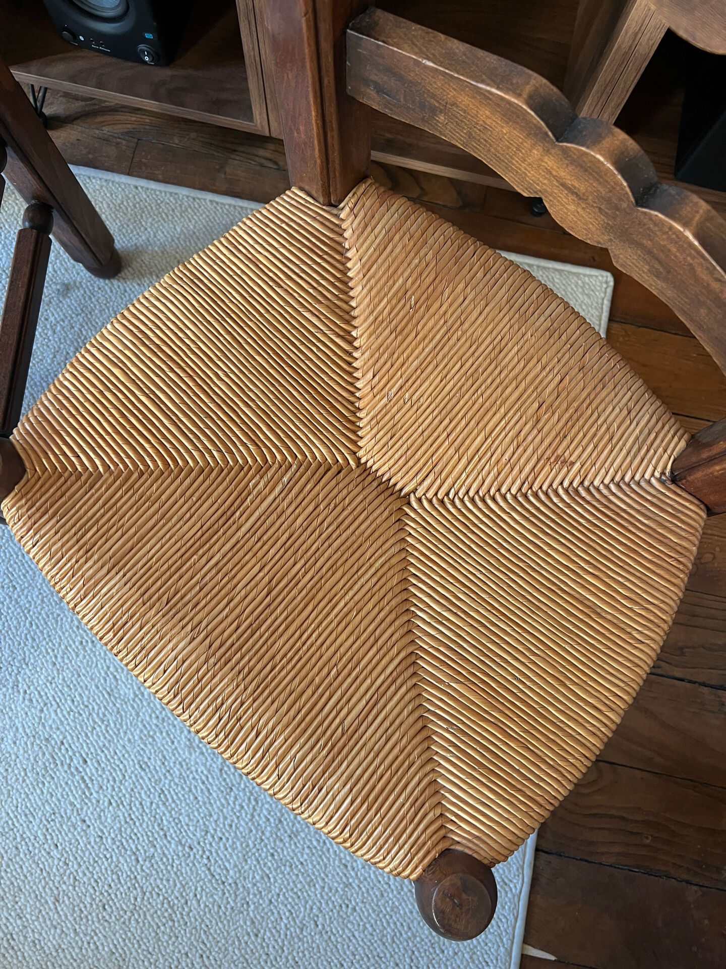 Pair of vintage armchairs with turned wood and woven rope seat.