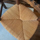 Pair of vintage armchairs with turned wood and woven rope seat.