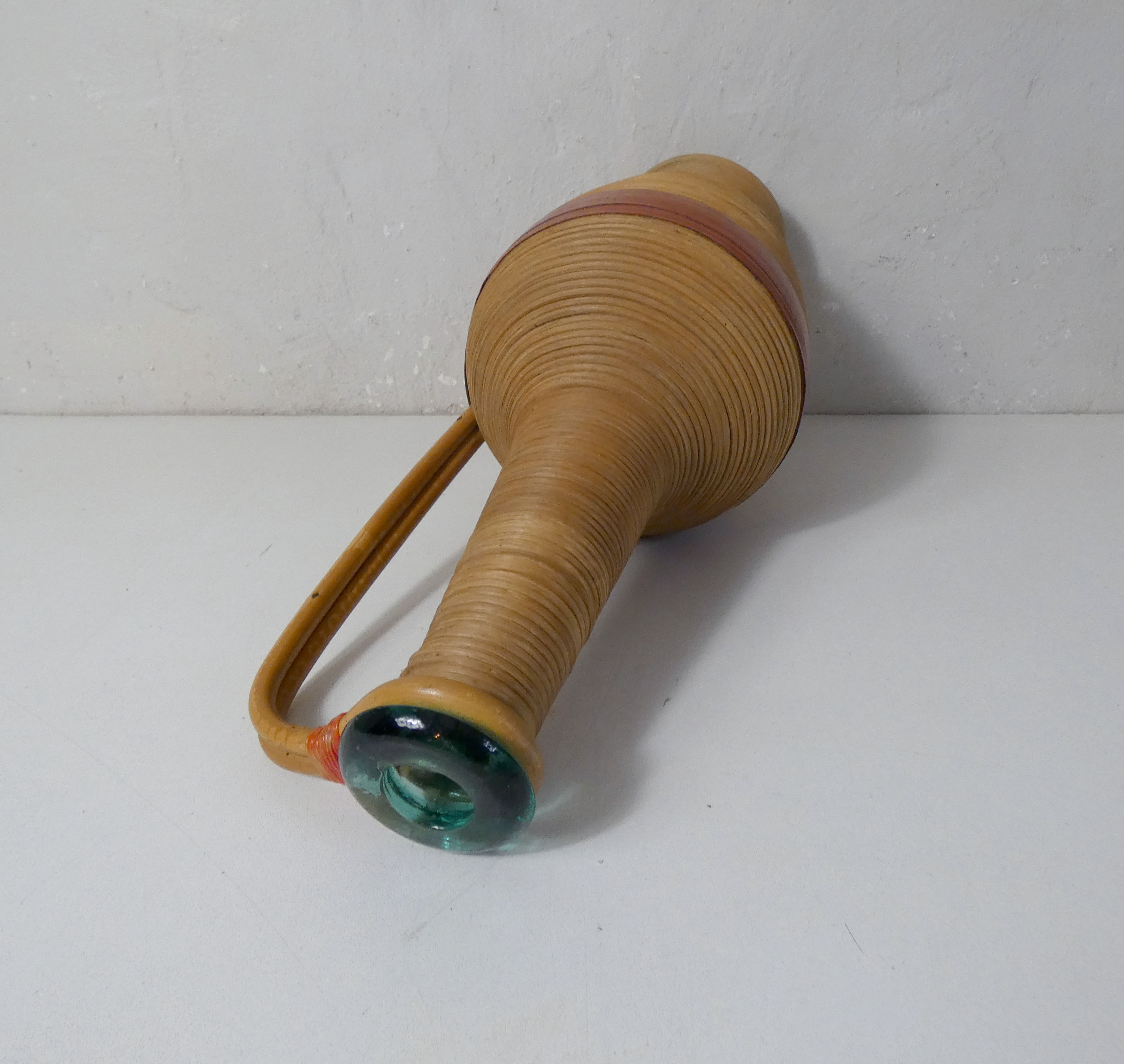 Old bottle dressed in vintage wood rattan